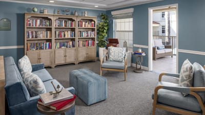 Cozy common area with bookshelves and seating