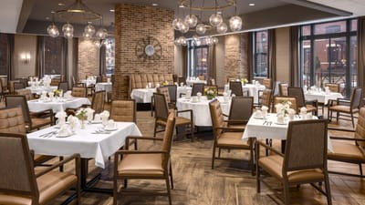 Dining area with tables set for a meal