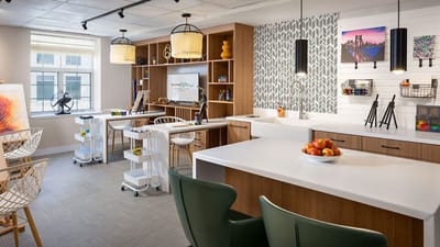 Bright and welcoming interior common area with art.