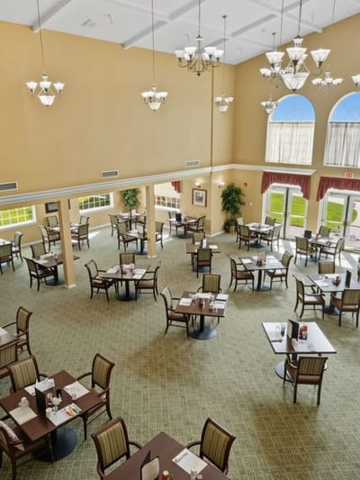 Bright dining room with tables set for meals