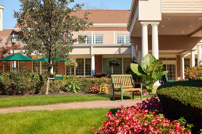 Outdoor seating area with well-maintained gardens