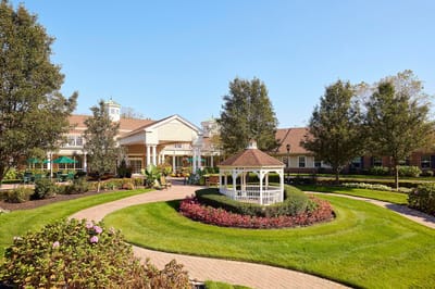 Beautiful landscaped outdoor area with gazebo and flowers