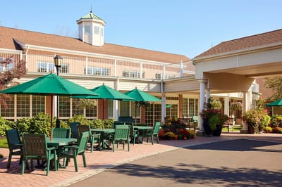 Outdoor seating area with tables and umbrellas