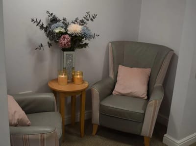 Cozy seating area with flowers and candles