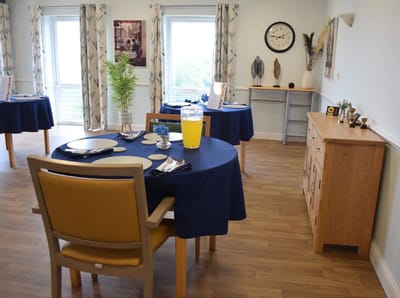 Dining area with tables set for a meal