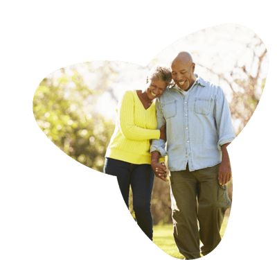 Couple walking together in a garden