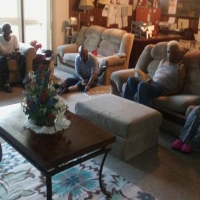 Residents engaging in conversation in a cozy common area