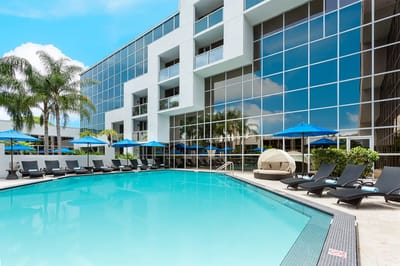 Beautiful outdoor pool area with lounge chairs and umbrellas
