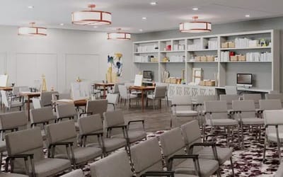 Bright activity room with seating and shelves
