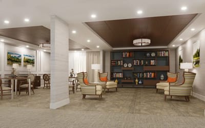 Common area with comfortable seating and bookshelves