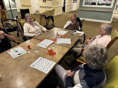 Residents playing bingo in a common area