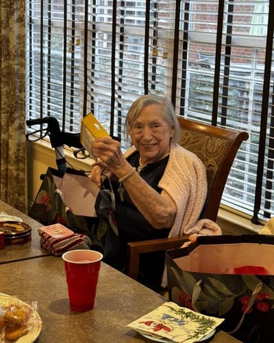 Resident holding a gift in a common area