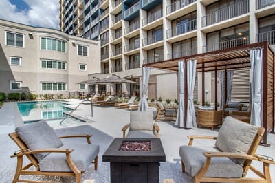 Outdoor patio area with seating and pool