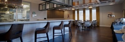 Bright dining room with a bar and seating area