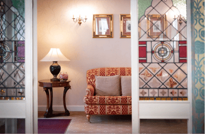 Cozy seating area with decorative window panels