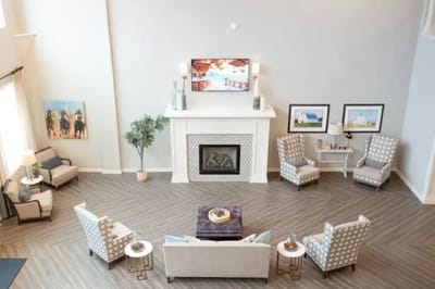 Well-furnished common area with seating and decor