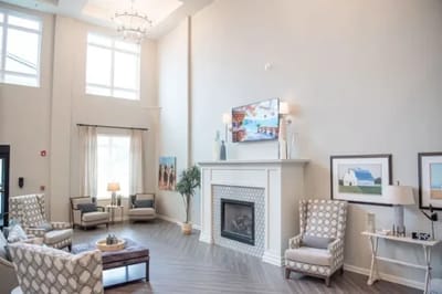 Bright common area with seating and fireplace
