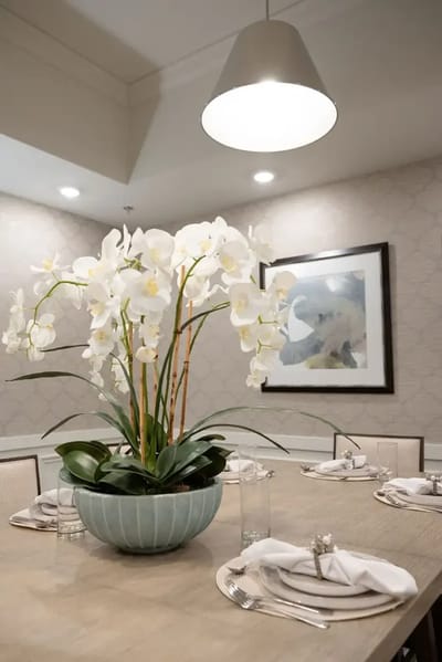 Elegant dining table set with flowers in a senior living facility