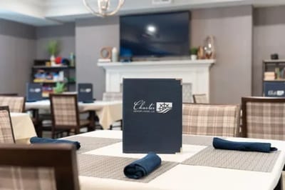 Dining room setup with menus and place settings