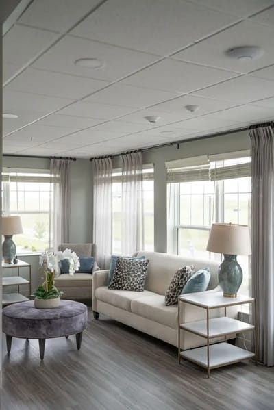 Bright, welcoming common area with seating and decor