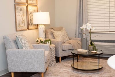 Cozy sitting area with comfortable chairs and decor