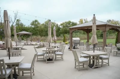 Outdoor patio area with tables and umbrellas