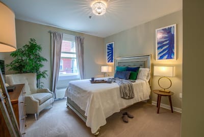 A cozy resident bedroom with tasteful decor