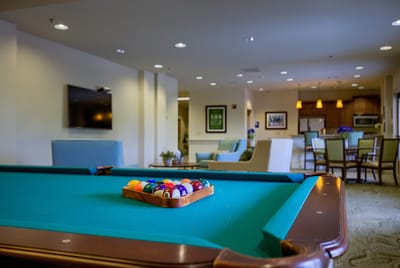 Interior view of a common area with a pool table