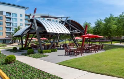 Outdoor dining area with shaded tables and seating
