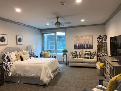 A well-furnished private resident room in a senior living facility
