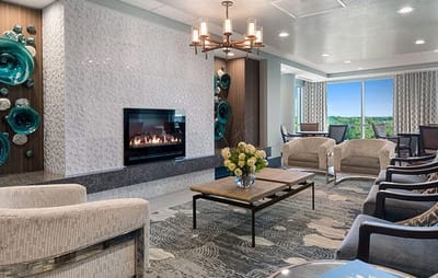Modern common area with a fireplace and seating
