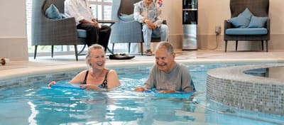 Residents enjoying an indoor pool activity