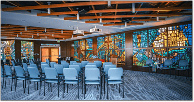 Interior view of a common area with stained glass windows