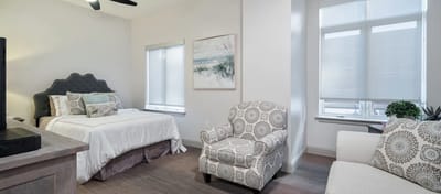 Cozy private resident room with bed and seating area