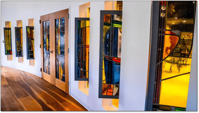 Colorful stained glass windows in a corridor