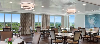 Bright dining room with flowers on tables