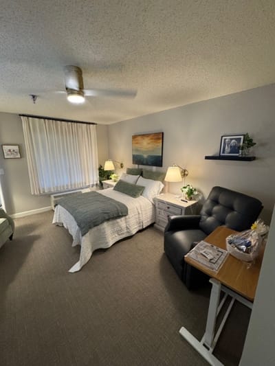 Cozy resident room with bed and seating area