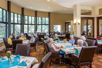 Residents enjoying a meal in the dining room
