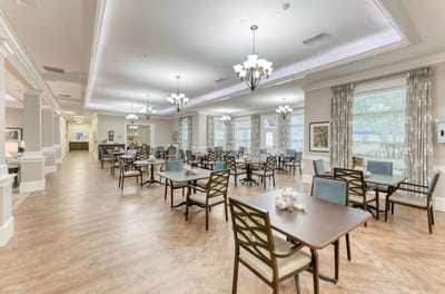 Bright dining area with seating for residents