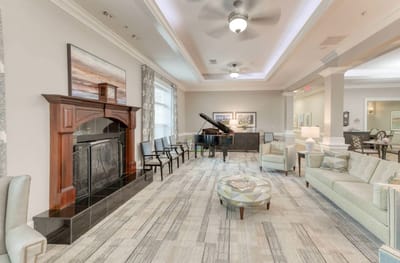 Interior lounge area with piano and seating