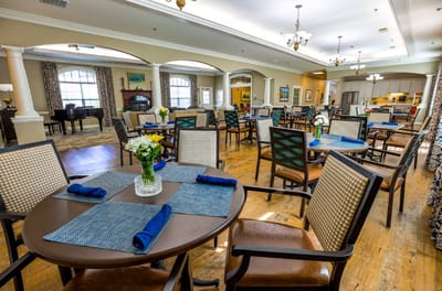 Dining area with tables set for residents