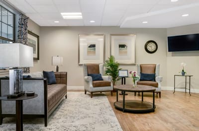 Comfortable common area with seating and decorative art