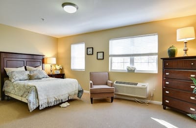Cozy private bedroom in a senior living facility