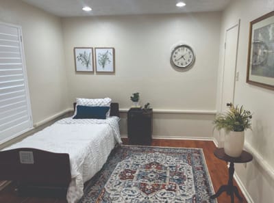 Cozy resident room with bed and decor
