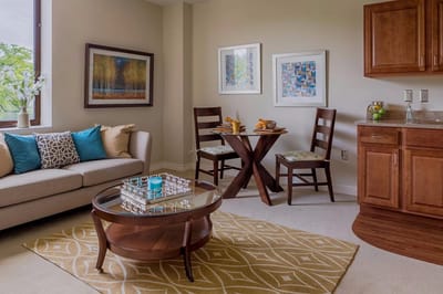 Cozy interior of a resident unit with seating and decor