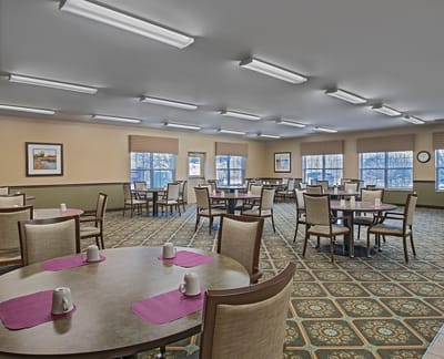 Bright dining area with tables and chairs