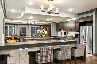 Modern kitchen area with seating and decor
