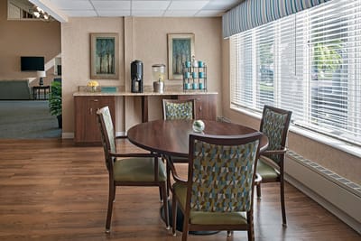 Bright and welcoming common area with tables and chairs