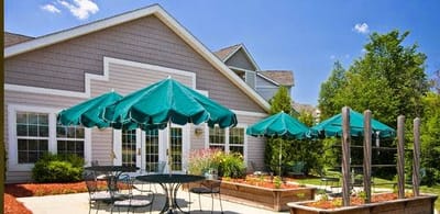Outdoor seating area with umbrellas next to building