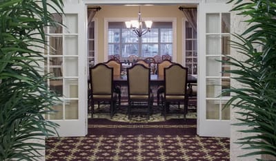 View of a dining room with elegant tables and chairs